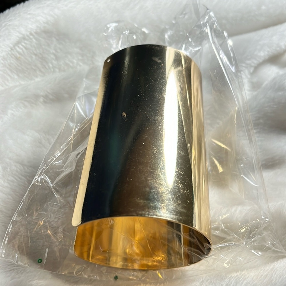 Bracelet arm, cuff, gold tone, never been out of bag no scuff snow marks